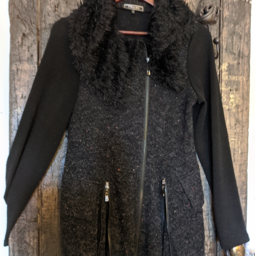 Bewitching and flattering angled zip sweater.